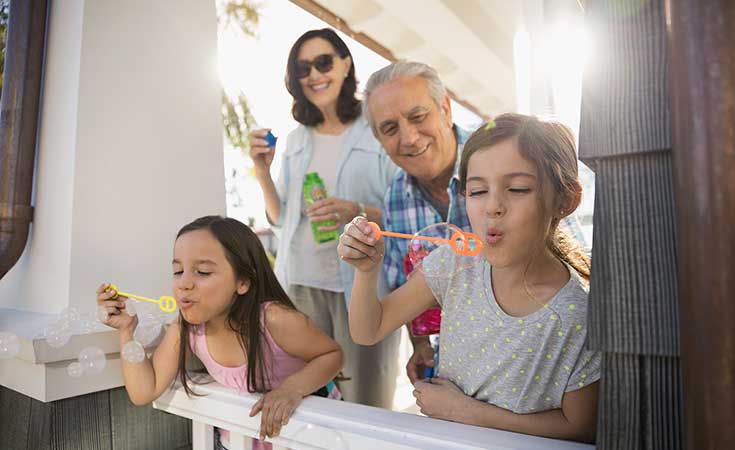 Family blowing bubbles