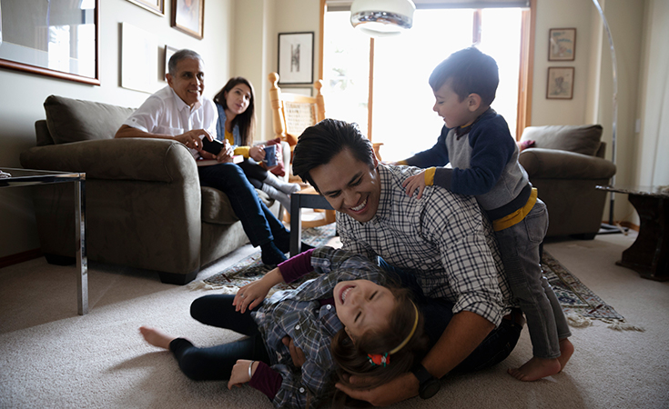 family laughing and playing together