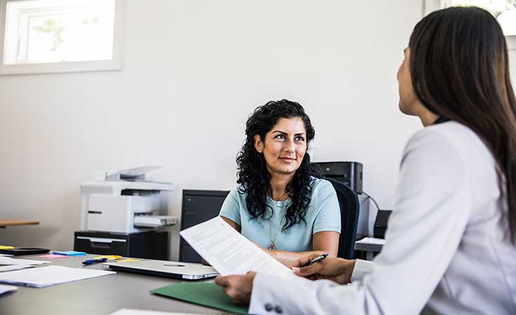 Professional talking to a client