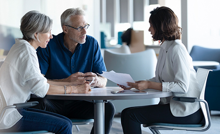 Couple meeting with Financial Advisor.