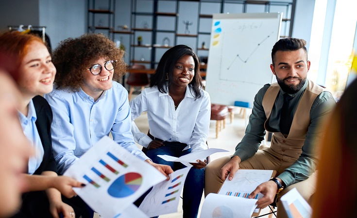 Coworkers sitting at a table laughing