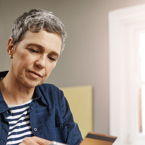 Lady looking down and a document