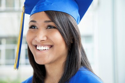 Girl in blue cap and gown